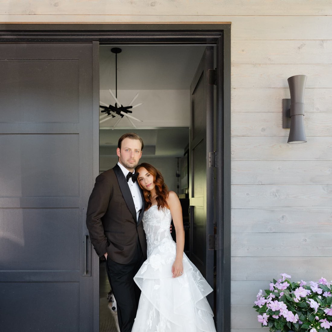 The bride and groom in the doorway