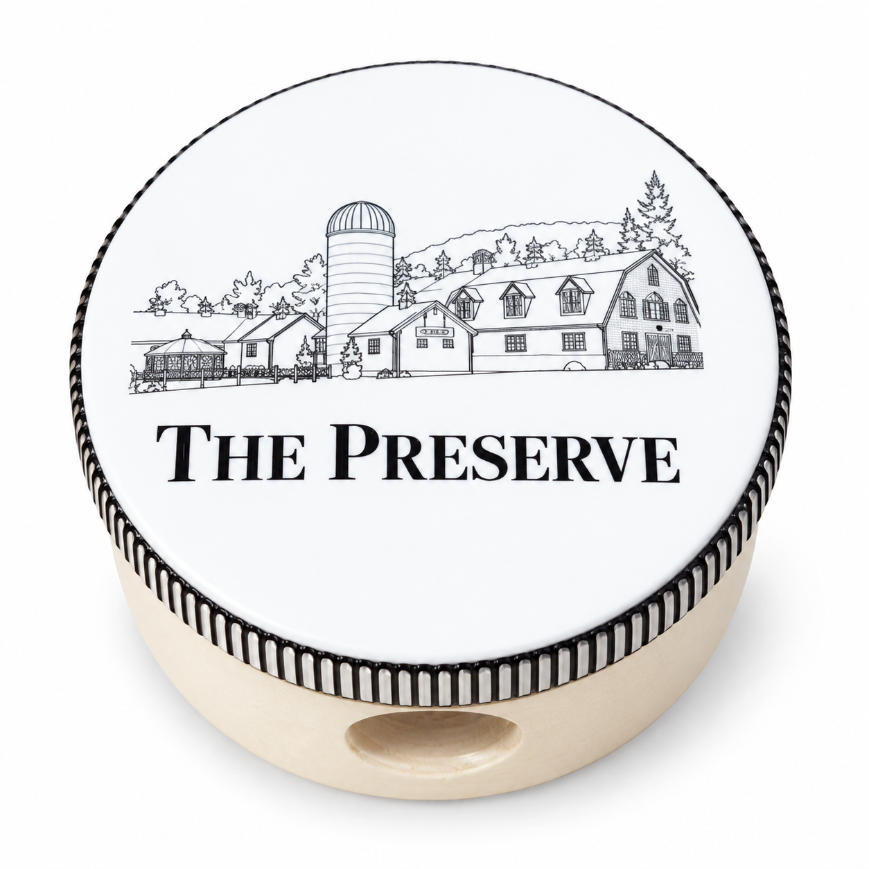 Custom tambourine with The Preserve branding on the head