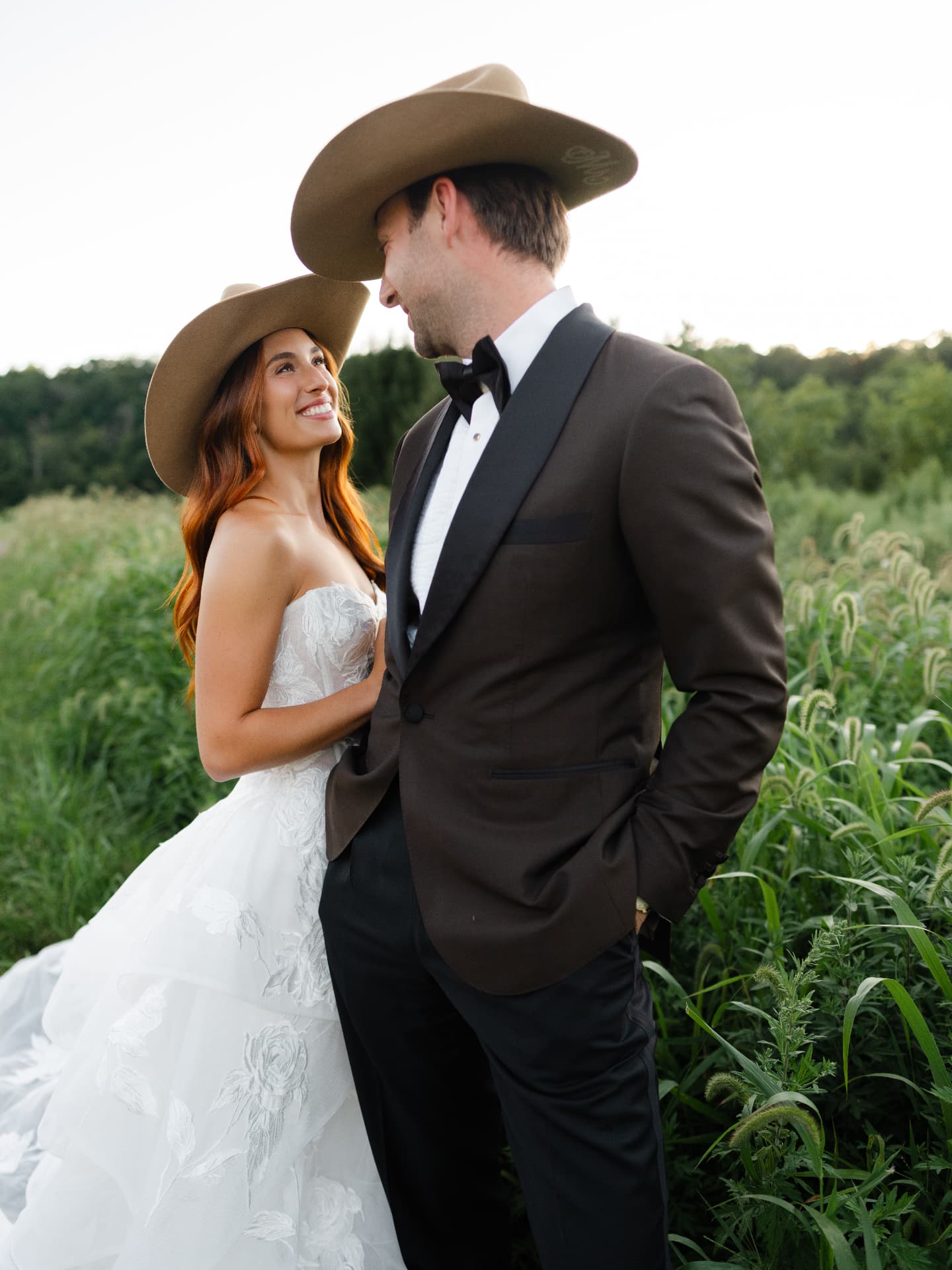 The couple face to face in cowboy hats